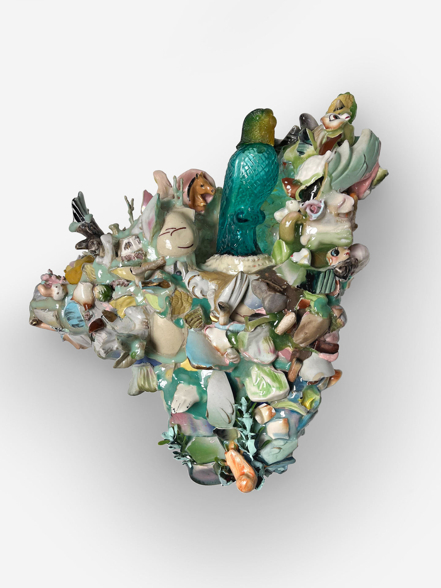 Mary Johnson, Shoreview, MN, USA. “Sweethearts (I),” broken ceramic figurines, plastic figurine and flowers, seashells, glass Avon bottle, acrylic, resin on foam.