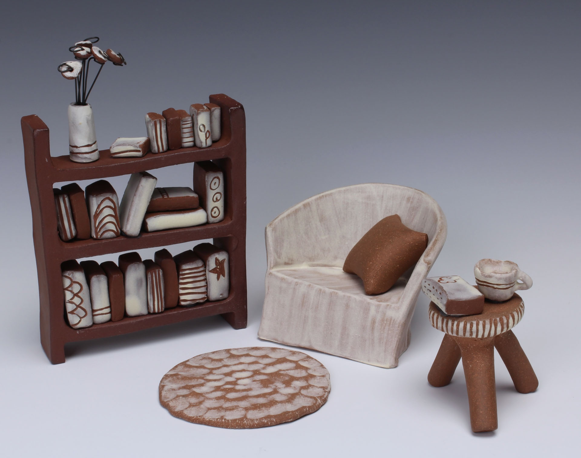 Jenny Dowd, Prairie Grove, AR, USA. “Tiny Library Adventure,” stoneware, slip, wire.