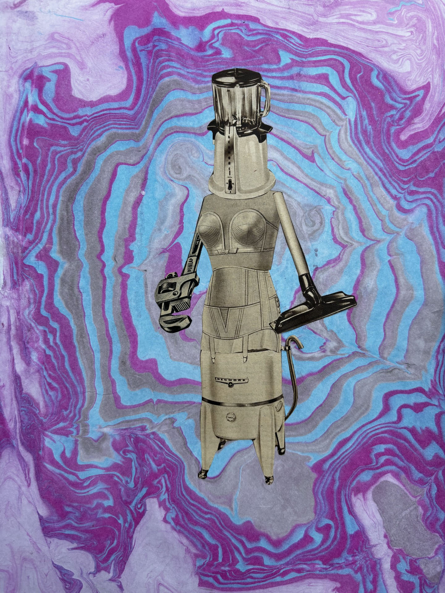 Deana Novak, Williston, ND, USA. “Galactic Femme-Bot 001,” collage on Suminagashi dyed paper.
