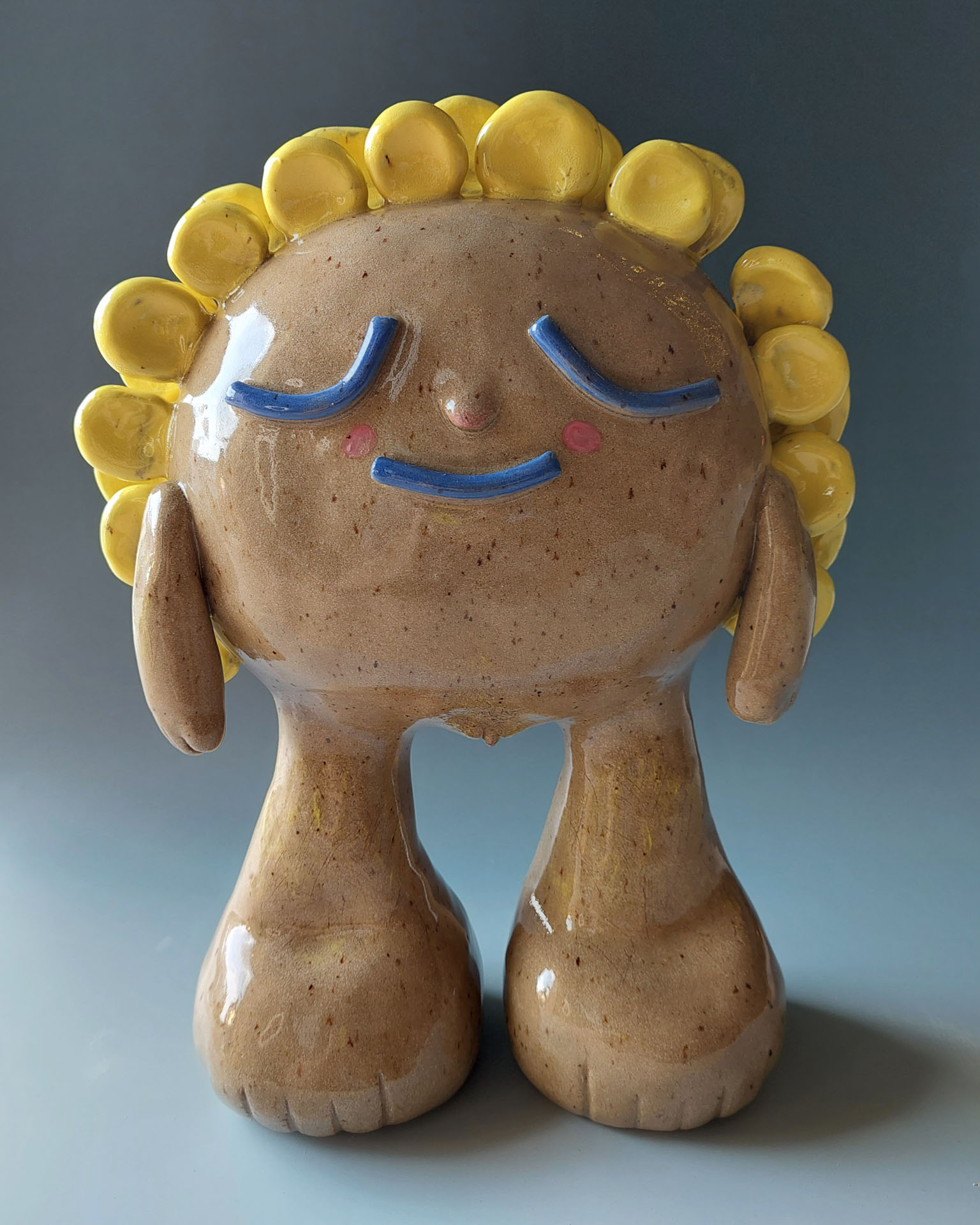 Jay Garre, Moorhead, MN, USA. “Sunflower Boy (transmasculine joy),” stoneware, colored slip.