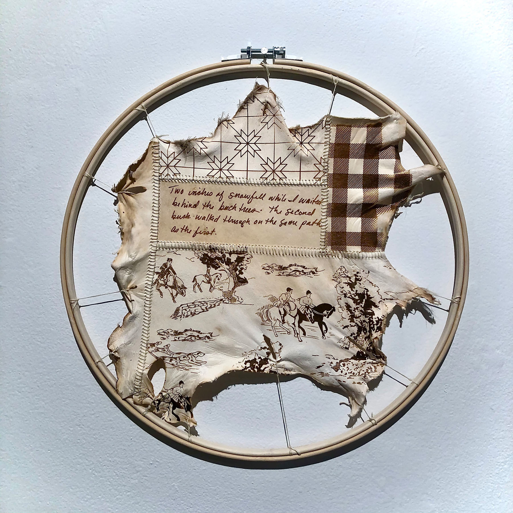 Tammy Renée Brackett, Andover, NY. “Untitled (Remnant) #2,” laser etched deer hide, thread, embroidery hoop.