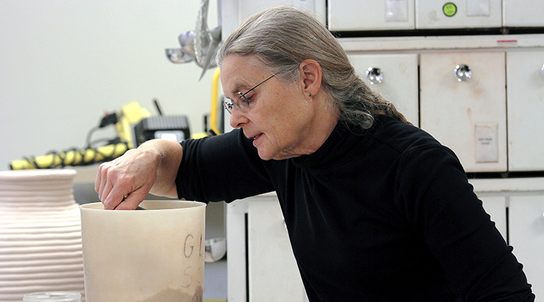 Linda Olson creating in ceramics
